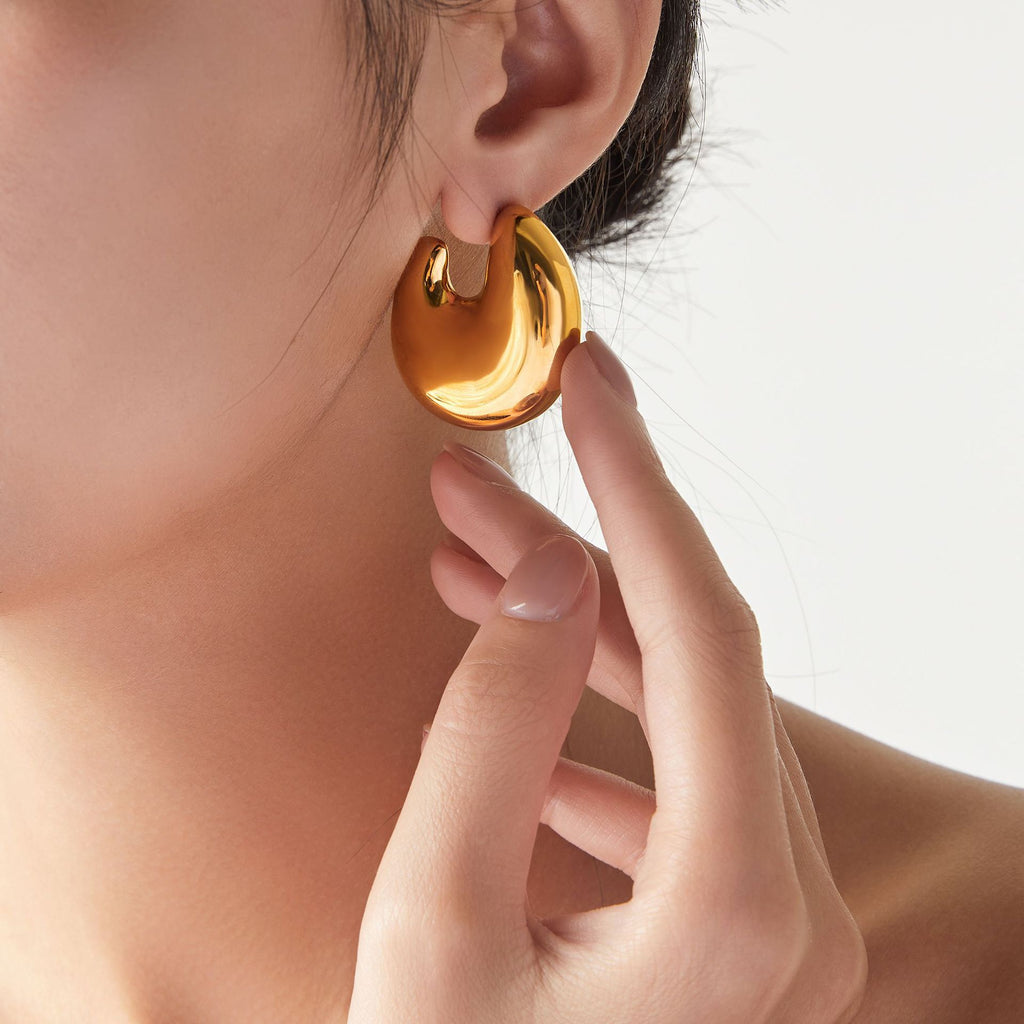 European and American fashion gold geometric C- shaped earrings titanium steel plated 18K gold simple design hollow bright three-dimensional earrings    uGlam